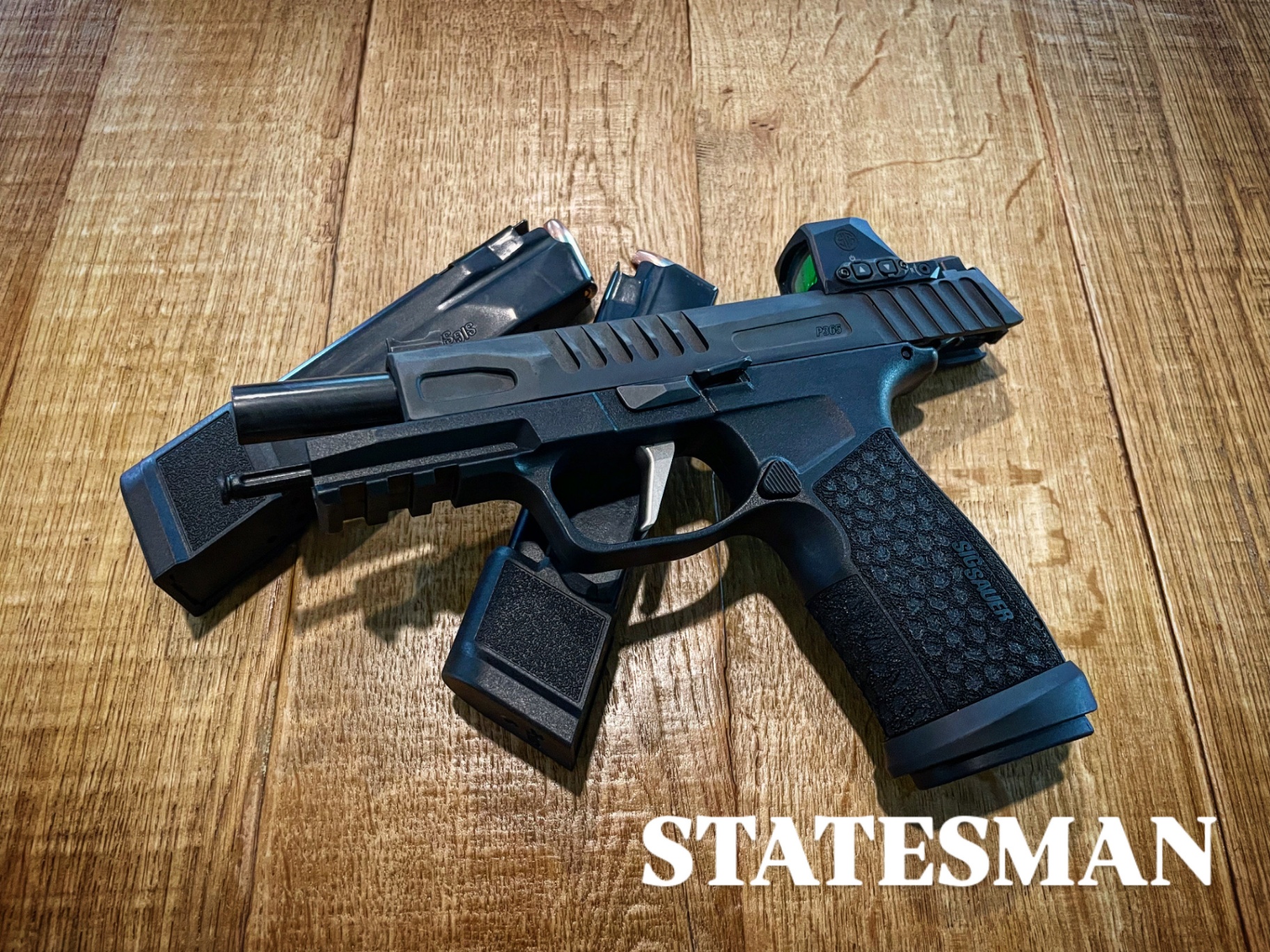 Sig Sauer P365 pistol with red dot optic